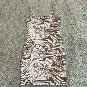 This is a nice cream and brown dress! Only worn once.